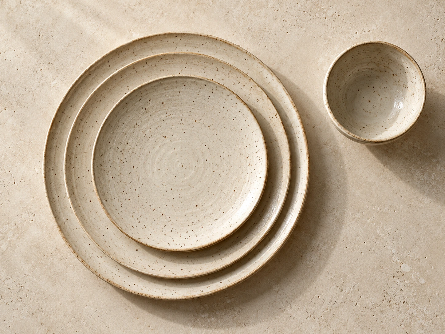 A collection of cream stoneware plates
